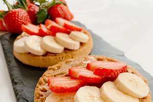 a nut butter waffle with strawberry and banana