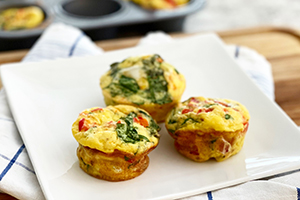 3 egg muffins on a plate for breakfast