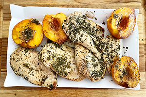 sweet and savory grilled chicken with peaches on a plate